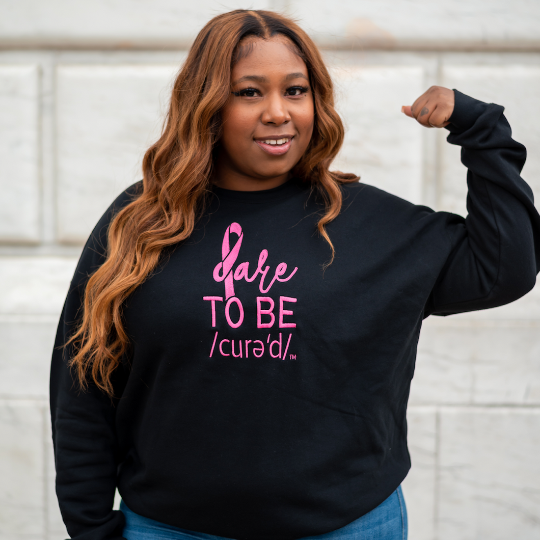 BLACK CREWNECK W PINK DARE TO BE CURED